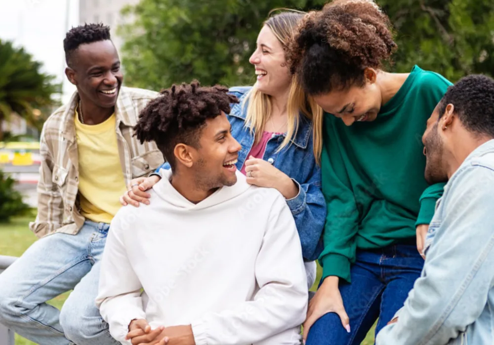 Youth chatting and smiling outside