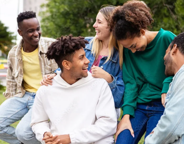 Youth chatting and smiling outside